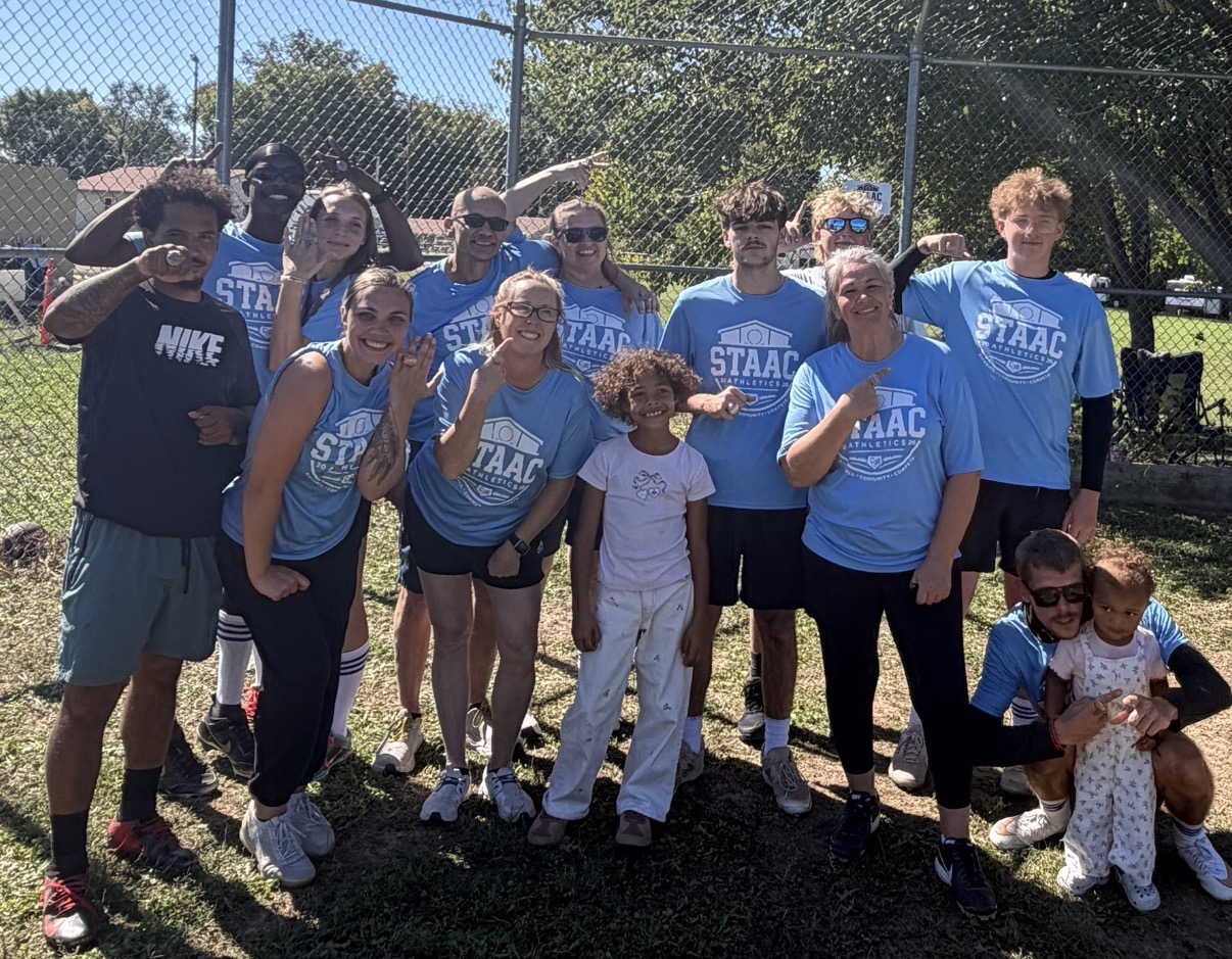 X-MIL'N-Z kickball champions celebrating with championship rings